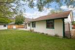 Enjoy the spacious backyard with a well-maintained lawn, perfect for outdoor activities and relaxation.