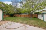 Enjoy this spacious backyard with a well-maintained lawn, perfect for outdoor activities and relaxation.