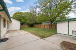 Discover this charming backyard featuring a well-maintained lawn, perfect for outdoor activities and relaxation.