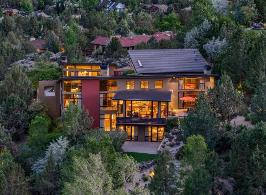 Experience modern luxury in this stunning multi-level home, nestled amidst lush greenery and offering breathtaking views.