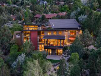 Experience modern luxury in this stunning multi-level home, nestled amidst lush greenery and offering breathtaking views.