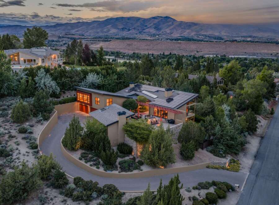 Experience luxury living in this stunning modern home, nestled amidst lush greenery with breathtaking mountain views.