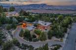 Experience luxury living in this stunning modern home, nestled amidst lush greenery with breathtaking mountain views.