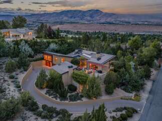 Experience luxury living in this stunning modern home, nestled amidst lush greenery with breathtaking mountain views.