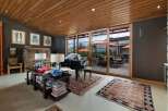 Experience luxury living in this stunning room featuring a grand piano and elegant decor.