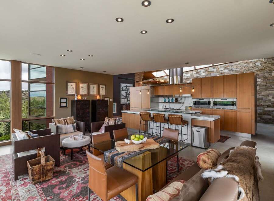 Experience luxury living in this open-concept home featuring a gourmet kitchen with custom wood cabinetry and a spacious island perfect for entertaining.