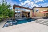 Experience luxury outdoor living with this stunning property featuring a sparkling swimming pool and an integrated spa, perfect for relaxation and entertainment.