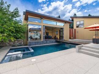 Experience luxury outdoor living with this stunning property featuring a sparkling swimming pool and an integrated spa, perfect for relaxation and entertainment.