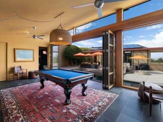 Experience ultimate relaxation and entertainment in this stunning home featuring a luxurious indoor pool area seamlessly connected to an outdoor oasis.