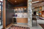 This stunning modern home features a sophisticated wet bar area, perfect for entertaining.