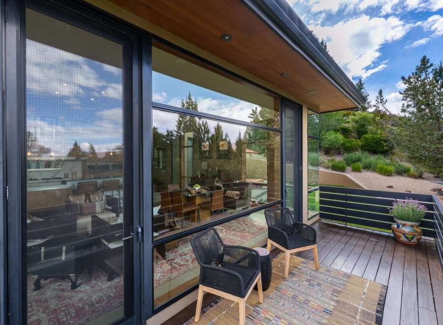 Experience seamless indoor-outdoor living with expansive floor-to-ceiling windows that frame breathtaking natural views.