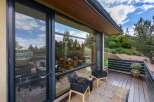 Experience seamless indoor-outdoor living with expansive floor-to-ceiling windows that frame breathtaking natural views.