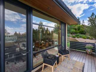Experience seamless indoor-outdoor living with expansive floor-to-ceiling windows that frame breathtaking natural views.
