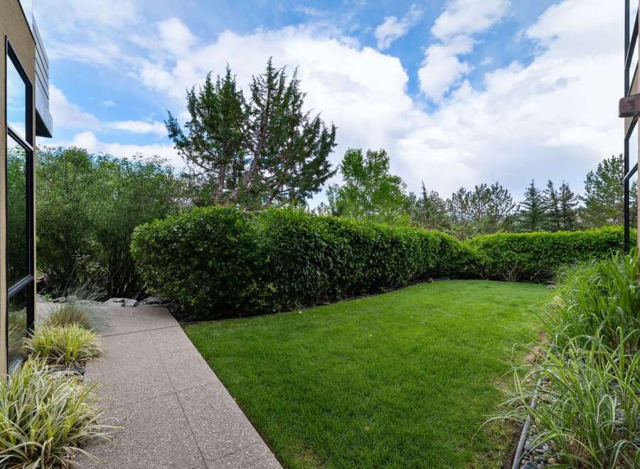Step outside to a beautifully manicured backyard, perfect for relaxation and entertaining.