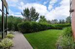Step outside to a beautifully manicured backyard, perfect for relaxation and entertaining.