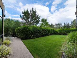 Step outside to a beautifully manicured backyard, perfect for relaxation and entertaining.