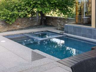 Experience luxury outdoor living with this stunning modern pool and spa combination.