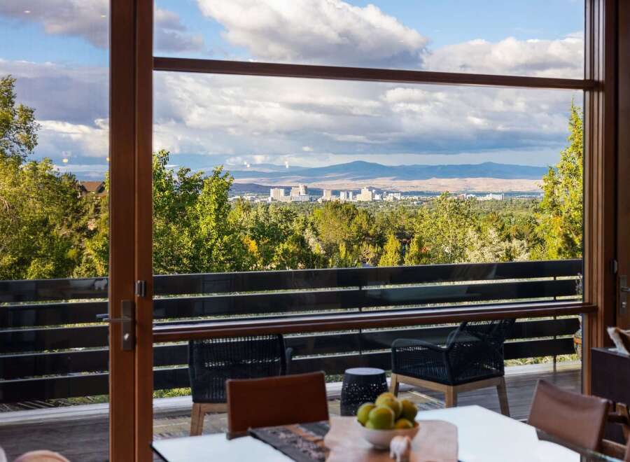 Experience breathtaking panoramic views of the city skyline and surrounding mountains from this stunning property.