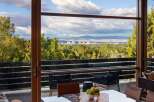 Experience breathtaking panoramic views of the city skyline and surrounding mountains from this stunning property.