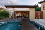 Experience seamless indoor-outdoor living with this stunning modern home featuring expansive bi-fold doors that open to a refreshing pool and entertainment area.