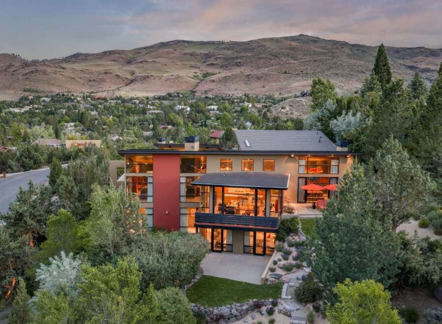 Experience luxury living in this modern architectural masterpiece nestled in a scenic hillside community.