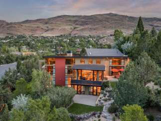 Experience luxury living in this modern architectural masterpiece nestled in a scenic hillside community.