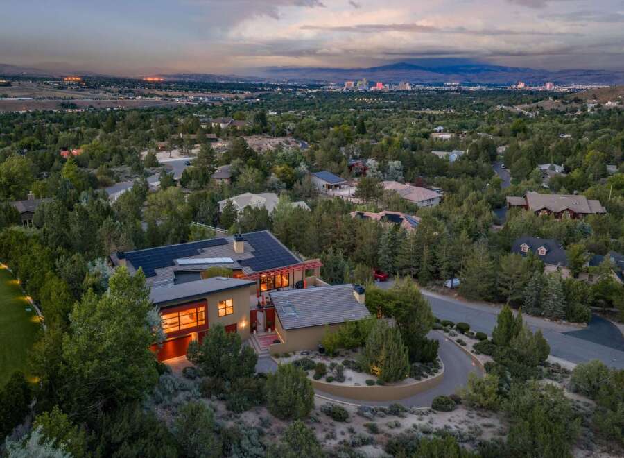 Experience luxury living in this stunning modern home, nestled amidst lush greenery with panoramic city views.