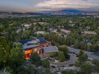 Experience luxury living in this stunning modern home, nestled amidst lush greenery with panoramic city views.