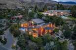 Experience luxury living in this modern architectural masterpiece nestled in a serene hillside setting.