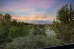 Experience breathtaking panoramic views of the city skyline and distant mountains from this elevated vantage point.