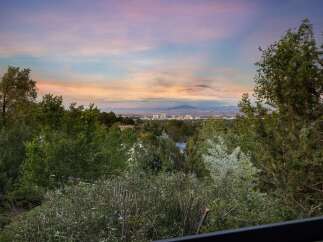 Experience breathtaking panoramic views of the city skyline and distant mountains from this elevated vantage point.
