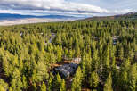 Nestled amidst a dense forest of mature pine trees, this secluded property offers a tranquil retreat.
