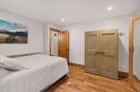 Discover this inviting bedroom featuring a comfortable bed and ample storage with a spacious double-door closet.