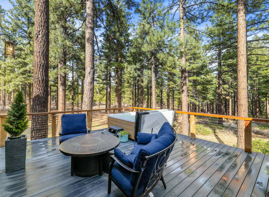 Enjoy the serene mountain lifestyle on this spacious deck, perfect for relaxation and entertaining.