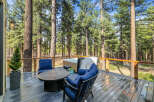 Enjoy the serene mountain lifestyle on this spacious deck, perfect for relaxation and entertaining.