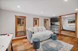 Experience cozy living in this charming space featuring a comfortable daybed perfect for lounging or extra sleeping arrangements.