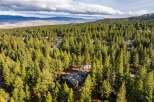 Nestled amidst a dense forest of mature pine trees, this secluded property offers a tranquil retreat.