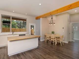 Experience modern living in this stunning open-concept kitchen and dining area.