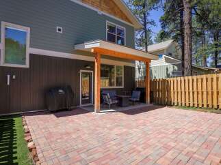 Enjoy outdoor living in this spacious backyard featuring a paved patio perfect for entertaining.