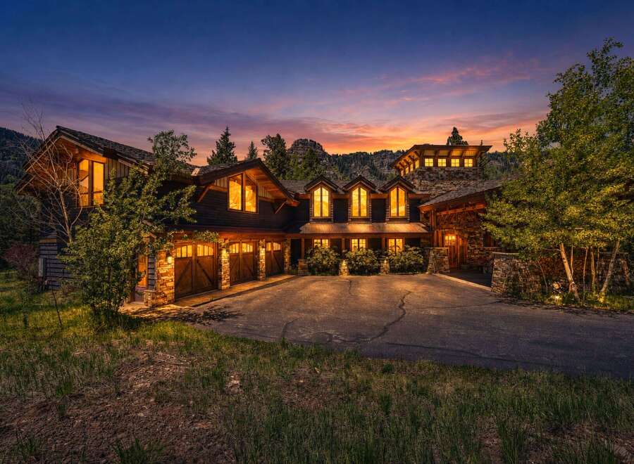 Experience luxury mountain living in this stunning custom-built home, nestled amidst breathtaking natural scenery.