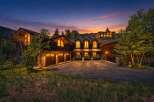 Experience luxury mountain living in this stunning custom-built home, nestled amidst breathtaking natural scenery.