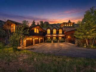 Experience luxury mountain living in this stunning custom-built home, nestled amidst breathtaking natural scenery.