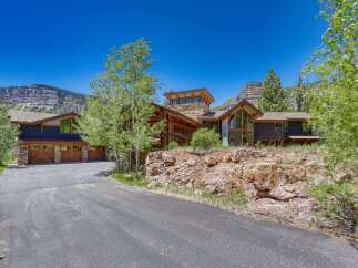 Nestled amidst stunning mountain scenery, this luxurious mountain home offers an unparalleled living experience.