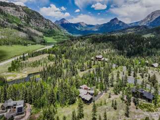 Discover unparalleled mountain living in this stunning estate nestled amidst a lush pine forest.