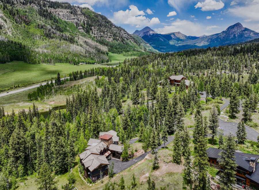 Nestled amidst a lush pine forest and rolling green hills, this stunning mountain estate offers unparalleled privacy and breathtaking natural beauty.
