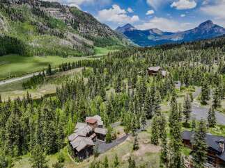 Nestled amidst a lush pine forest and rolling green hills, this stunning mountain estate offers unparalleled privacy and breathtaking natural beauty.