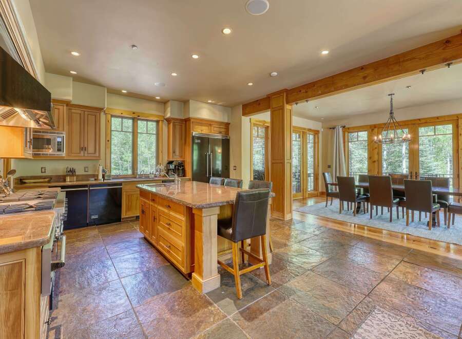 Experience luxury mountain living in this stunning kitchen and dining area.