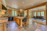 Experience luxury mountain living in this stunning kitchen and dining area.