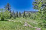 Discover this stunning property nestled amidst a serene landscape, offering breathtaking mountain views and lush green meadows.