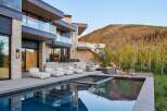 Experience luxury living with this stunning modern home featuring a sleek infinity pool and expansive outdoor entertaining space.